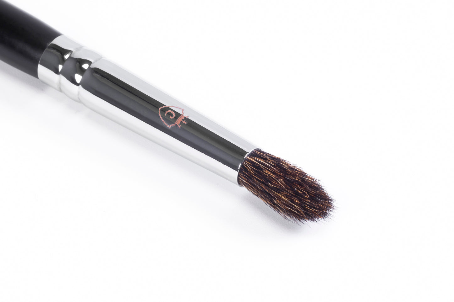 One makeup brush with a black handle, silver metal ferrule, and brown bristles on a white background.