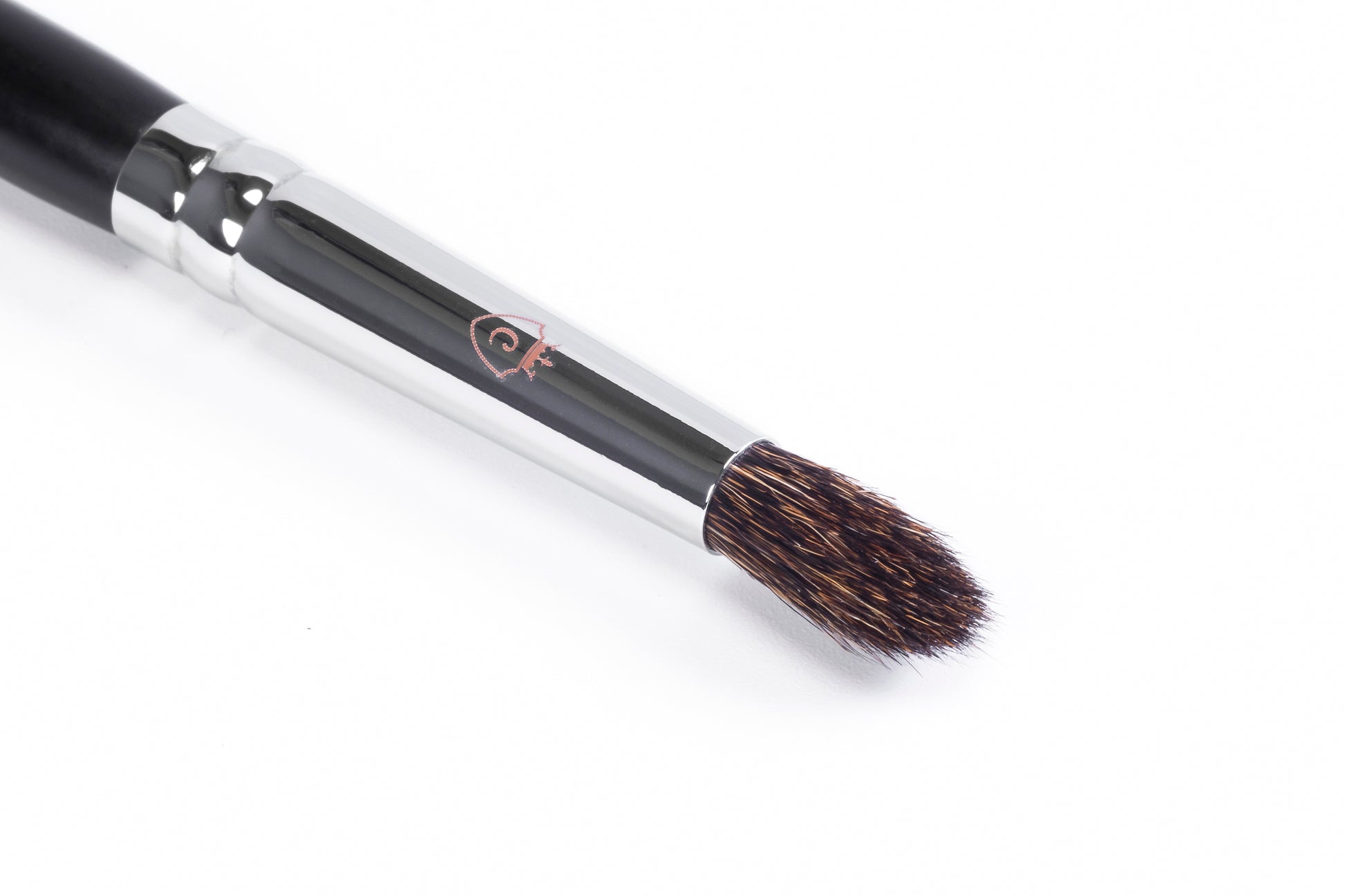 One makeup brush with a black handle, silver metal ferrule, and brown bristles on a white background.