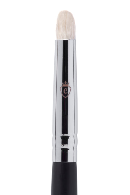 Single makeup brush with white bristles, a silver metal ferrule featuring a crowned C logo, and a black handle.