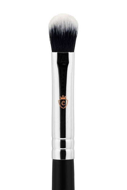 Single makeup brush with black and white bristles, a silver metal ferrule, and a black handle featuring a crown logo.
